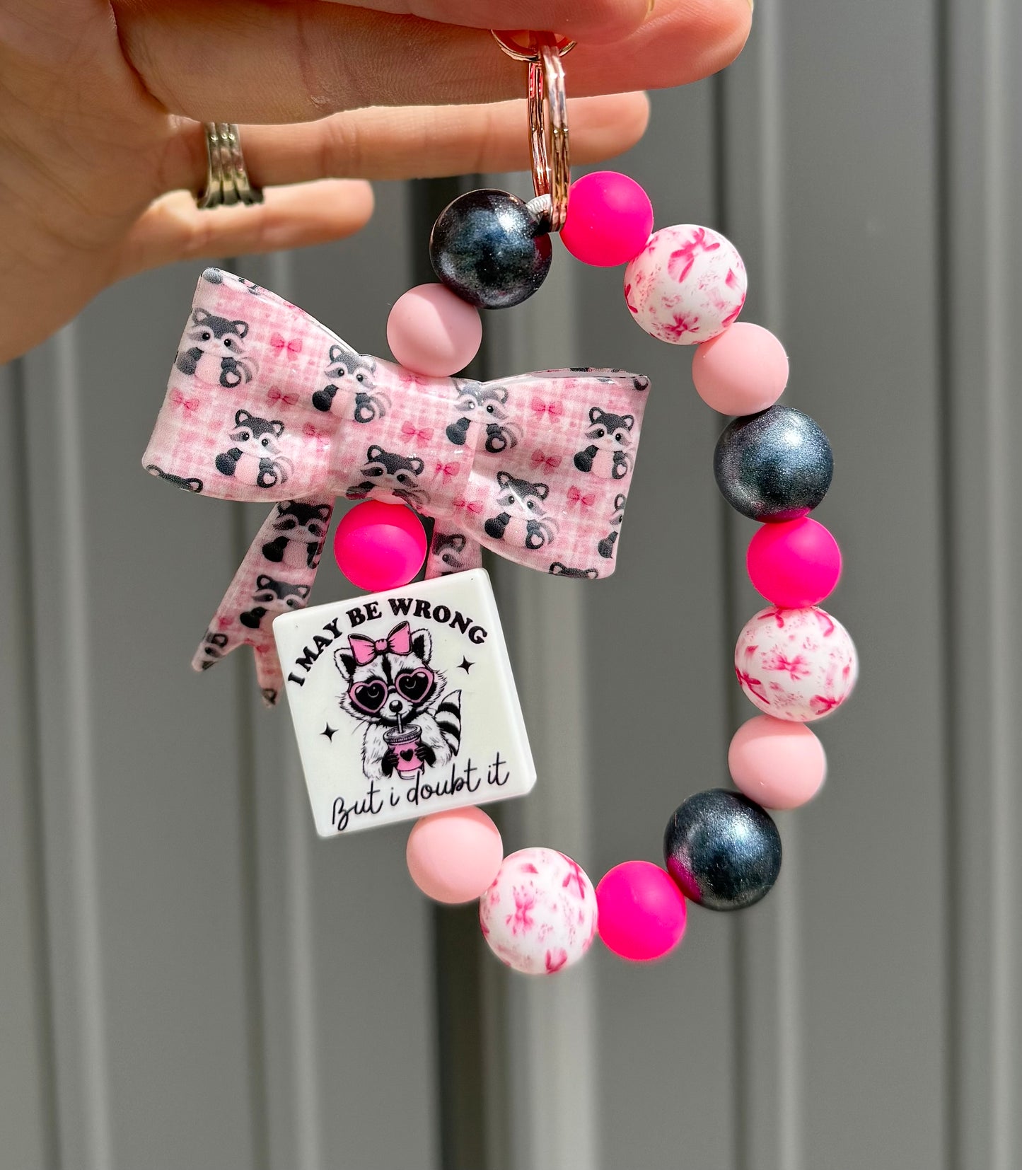 Big Bow Raccoon “I May Be Wrong… But I Doubt It” Wristlet