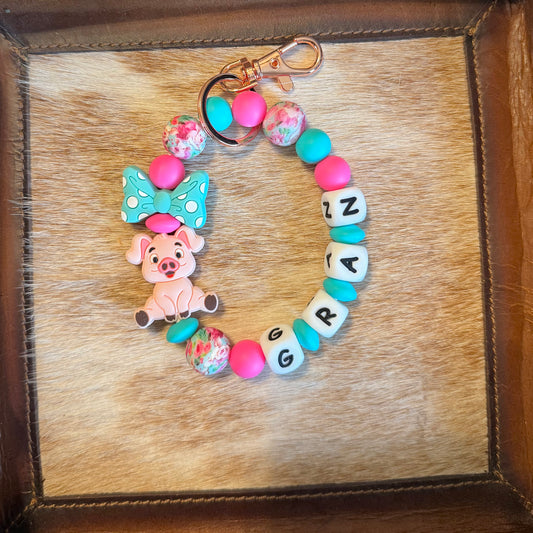 Pig Pink and Turquosie Bow Wristlet with Name