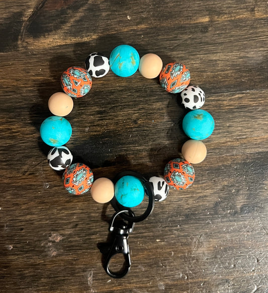 Rust Aztec Turquoise Stone Cow Print Wristlet