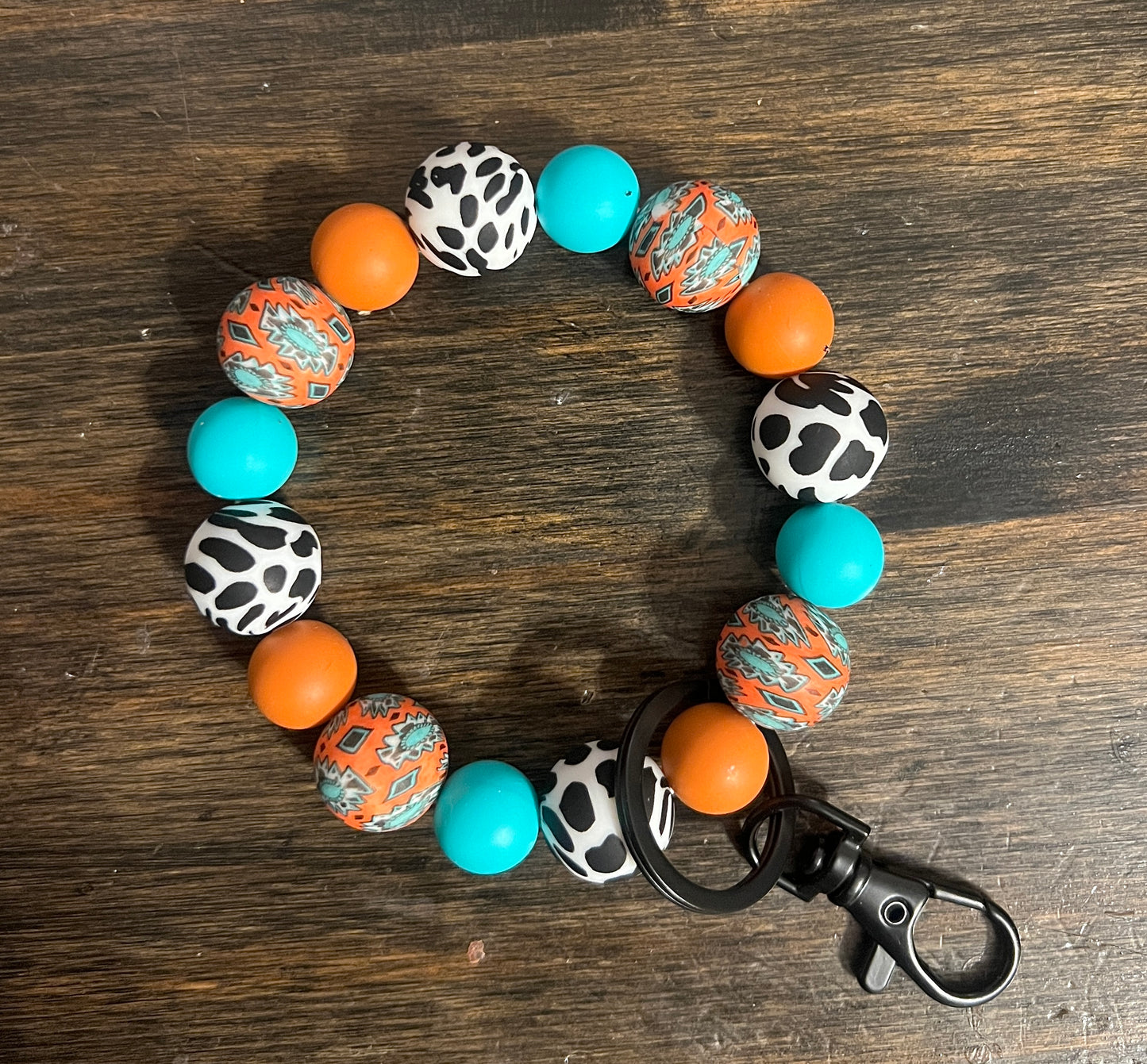 Rust Orange Cow Print Aztec Wristlet