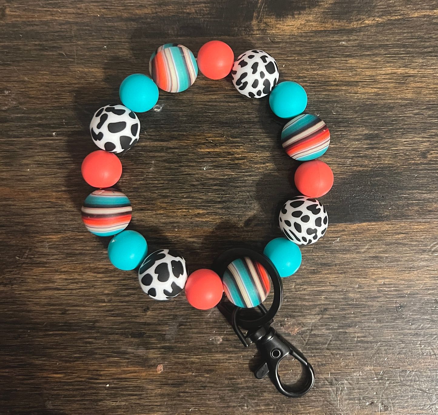 Serape Coral Cow Print Wristlet