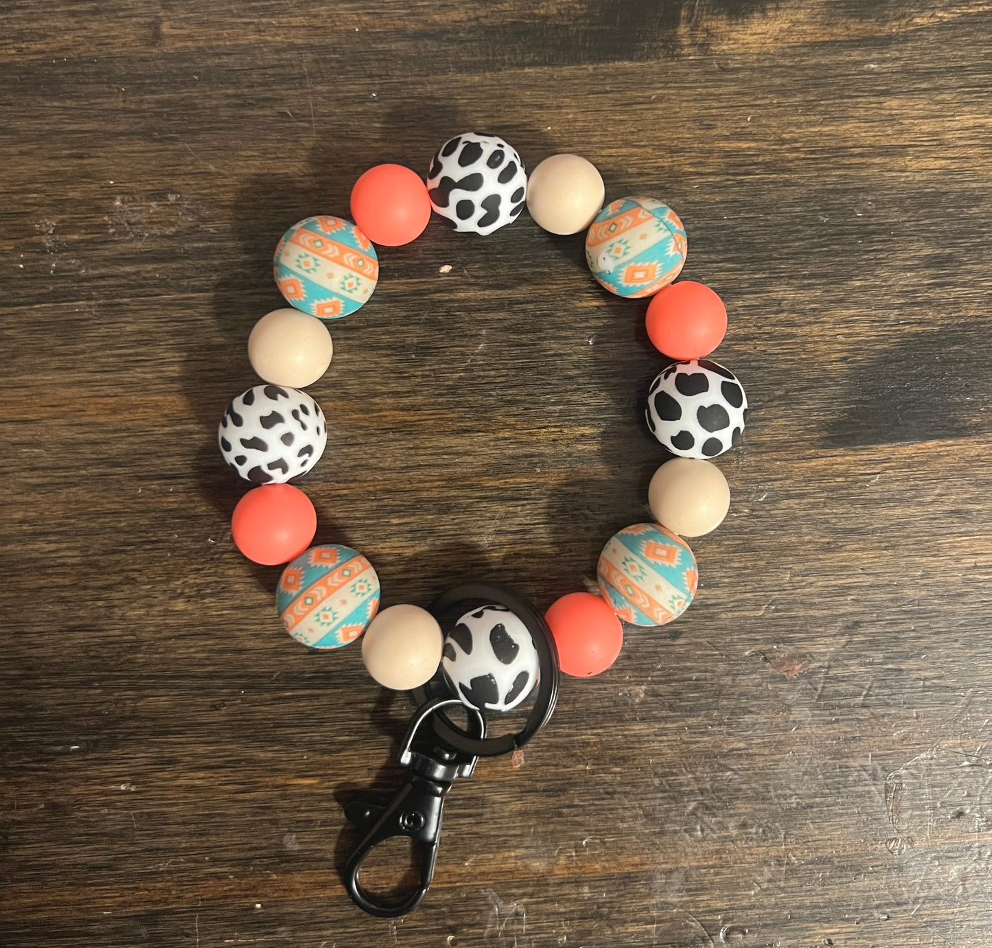 Coral Aztec Cow Print Wristlet