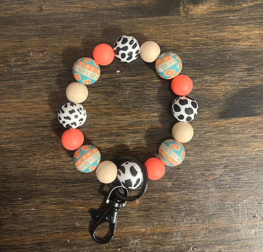 Coral Aztec Cow Print Wristlet