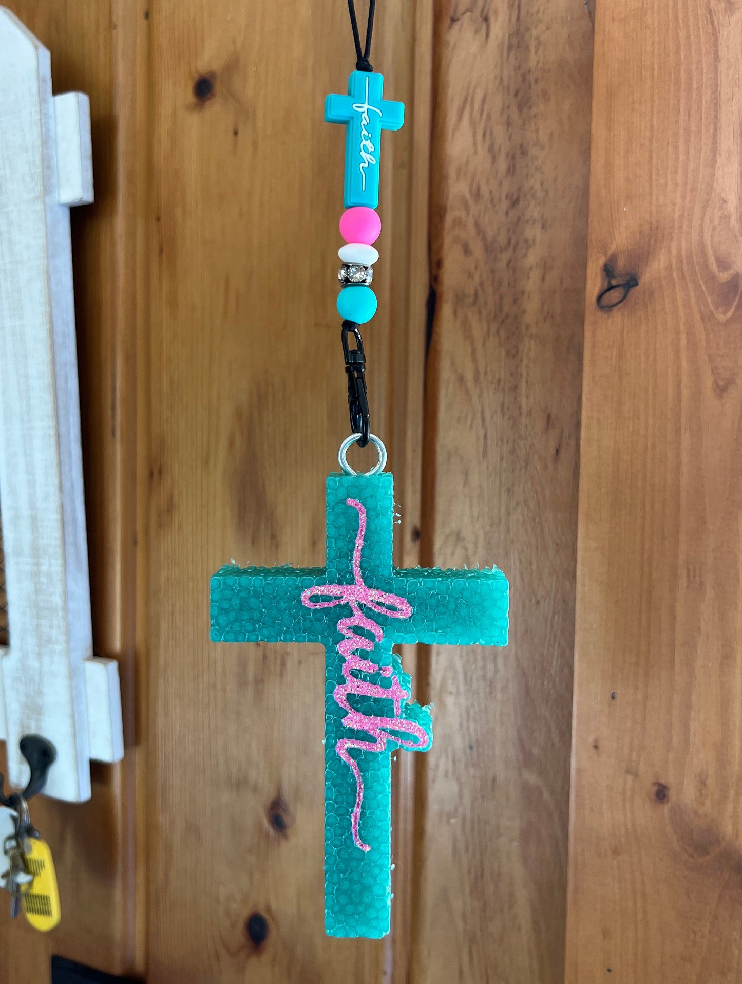 Turquoise Cross Pink Writing
