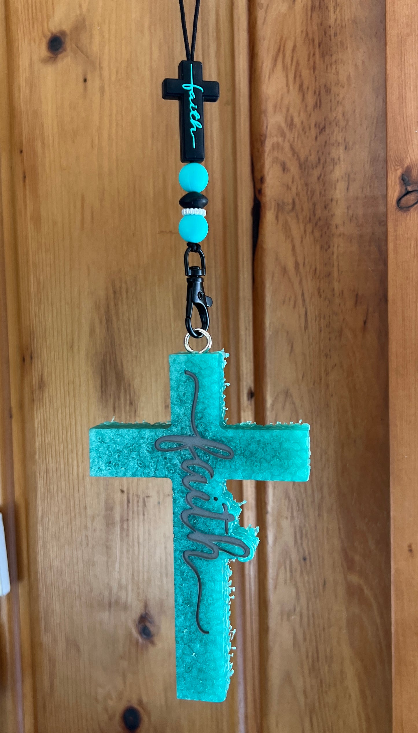 Turquoise Cross With Gray Writing