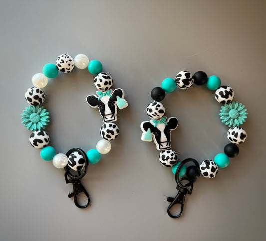 Black Cow Turquoise Flower Wristlet
