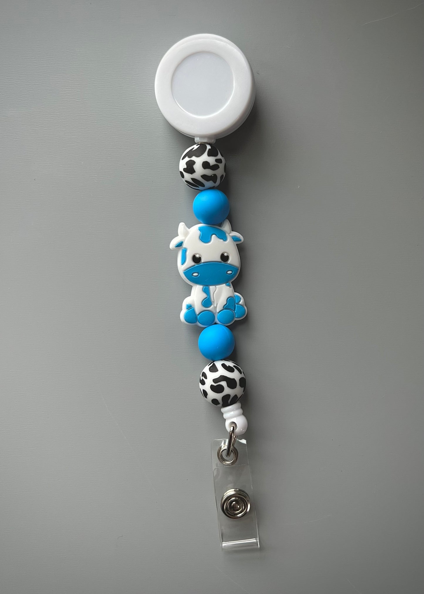 Blue Cow Badge Reel