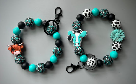 Western turquoise Cow print Wristlet