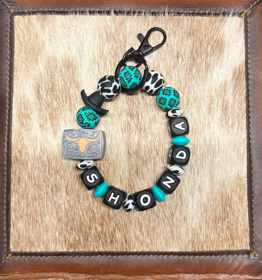 Turquoise Aztec Cowhide Custom Name Wristlet