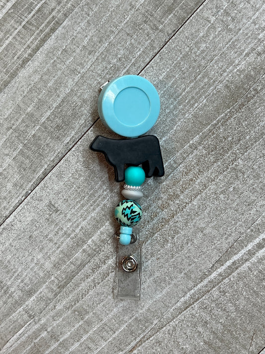 Black Steer Cow Mint/Turquoise Aztec Badge Reel