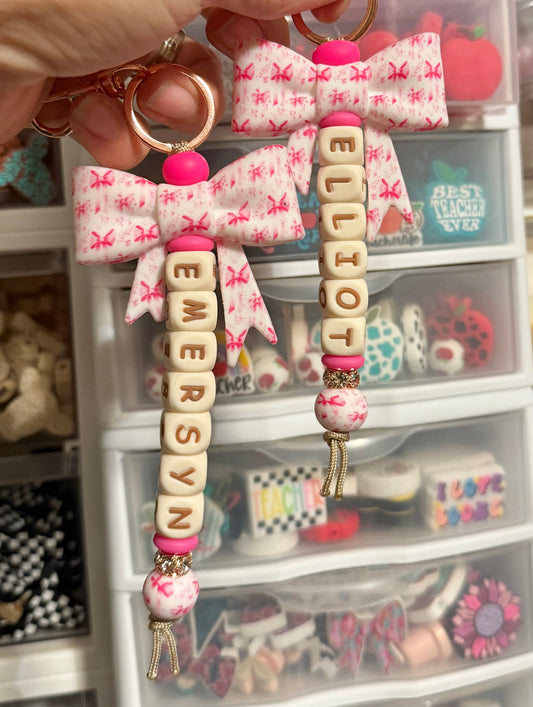 Pink Ribbon Bow Beige Letters Custom Name Keychain