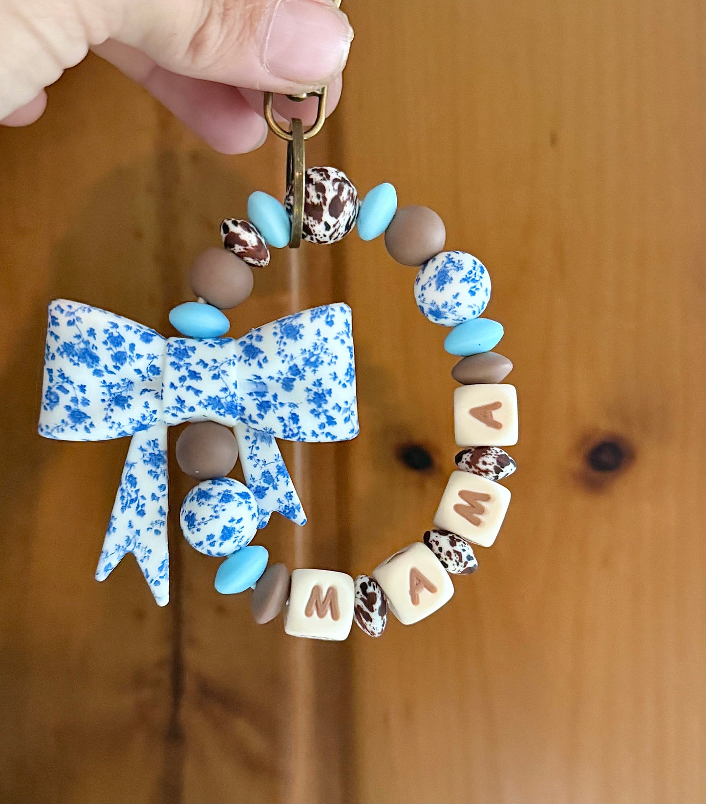 Dainty Blue Floral Brown Cowhide Wristlet