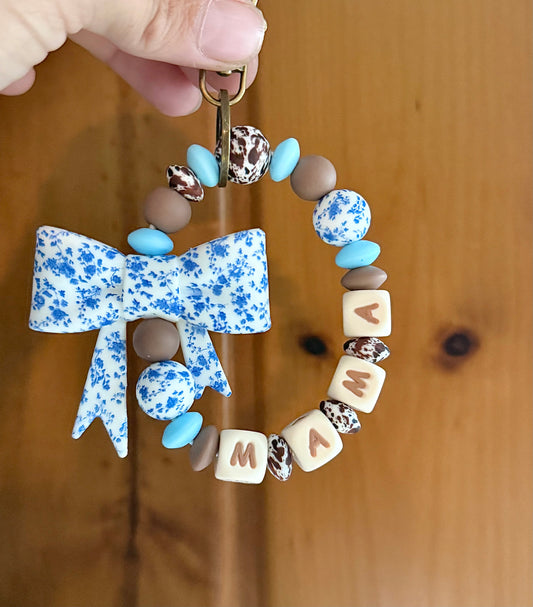 Dainty Blue Floral Brown Cowhide Wristlet
