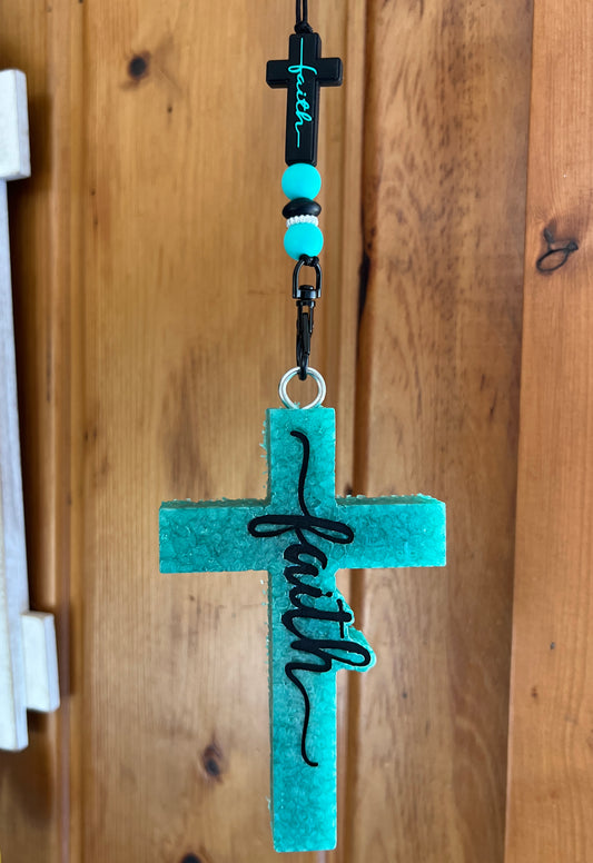 Turquoise Cross with Black Writing