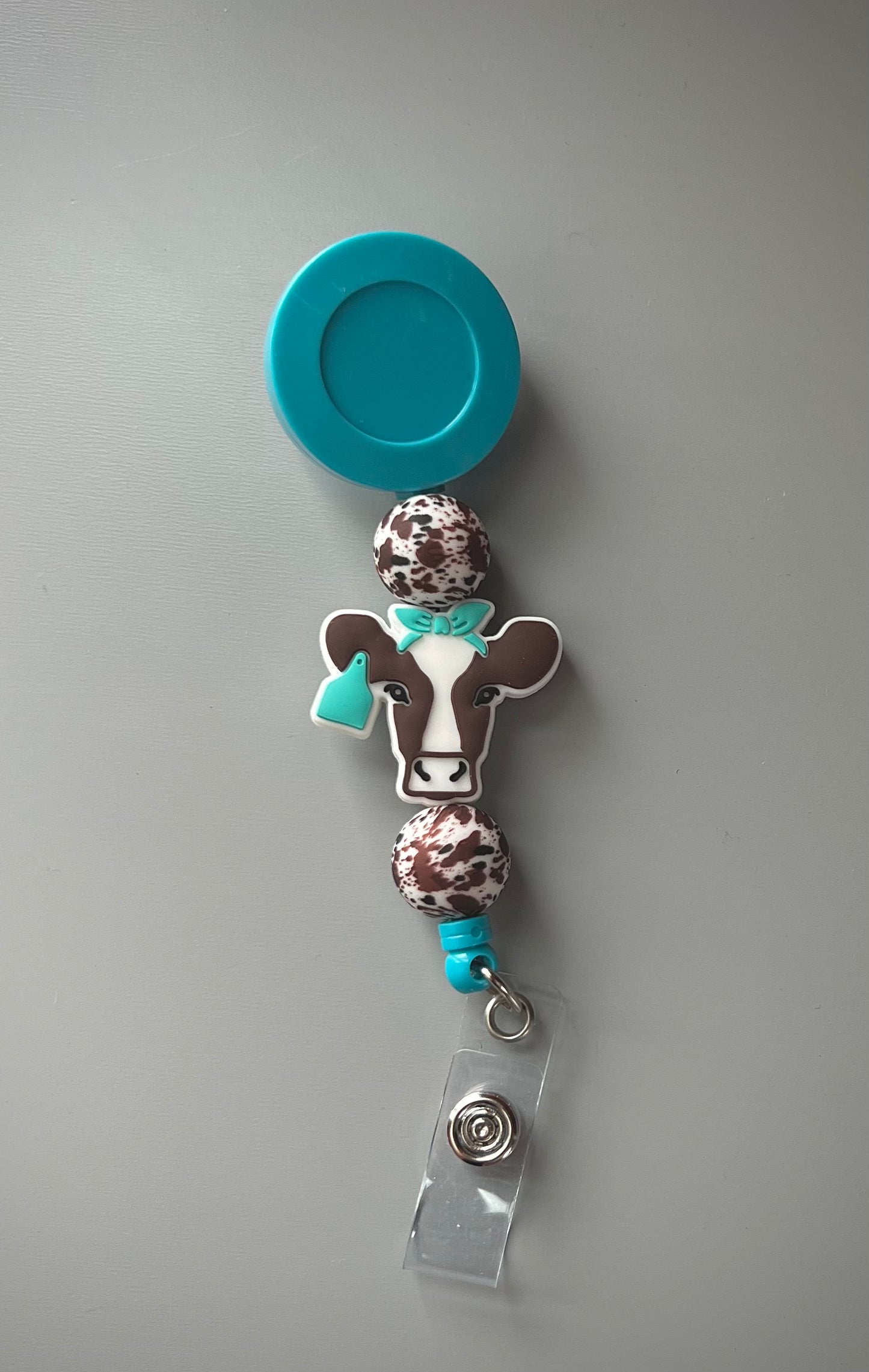 Brown Cow Turquoise Badge Reel